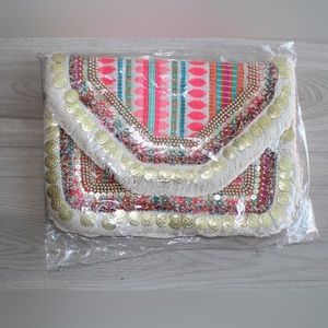 Boho Clutch/crossbody bag with Pink. It has chain in it to use it as a crossbody